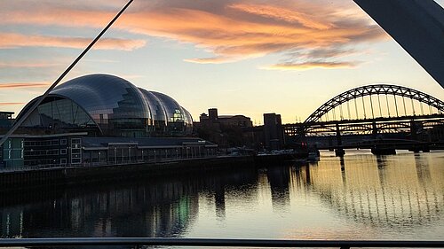 A view looking toward the Glasshouse from the Gateshead Millenium Bridge